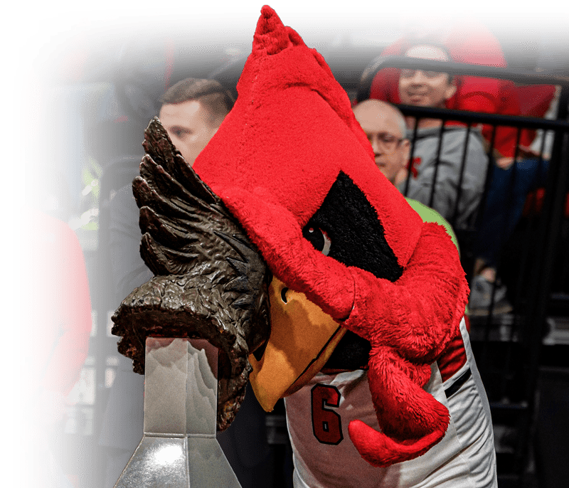 mascot touching trophy